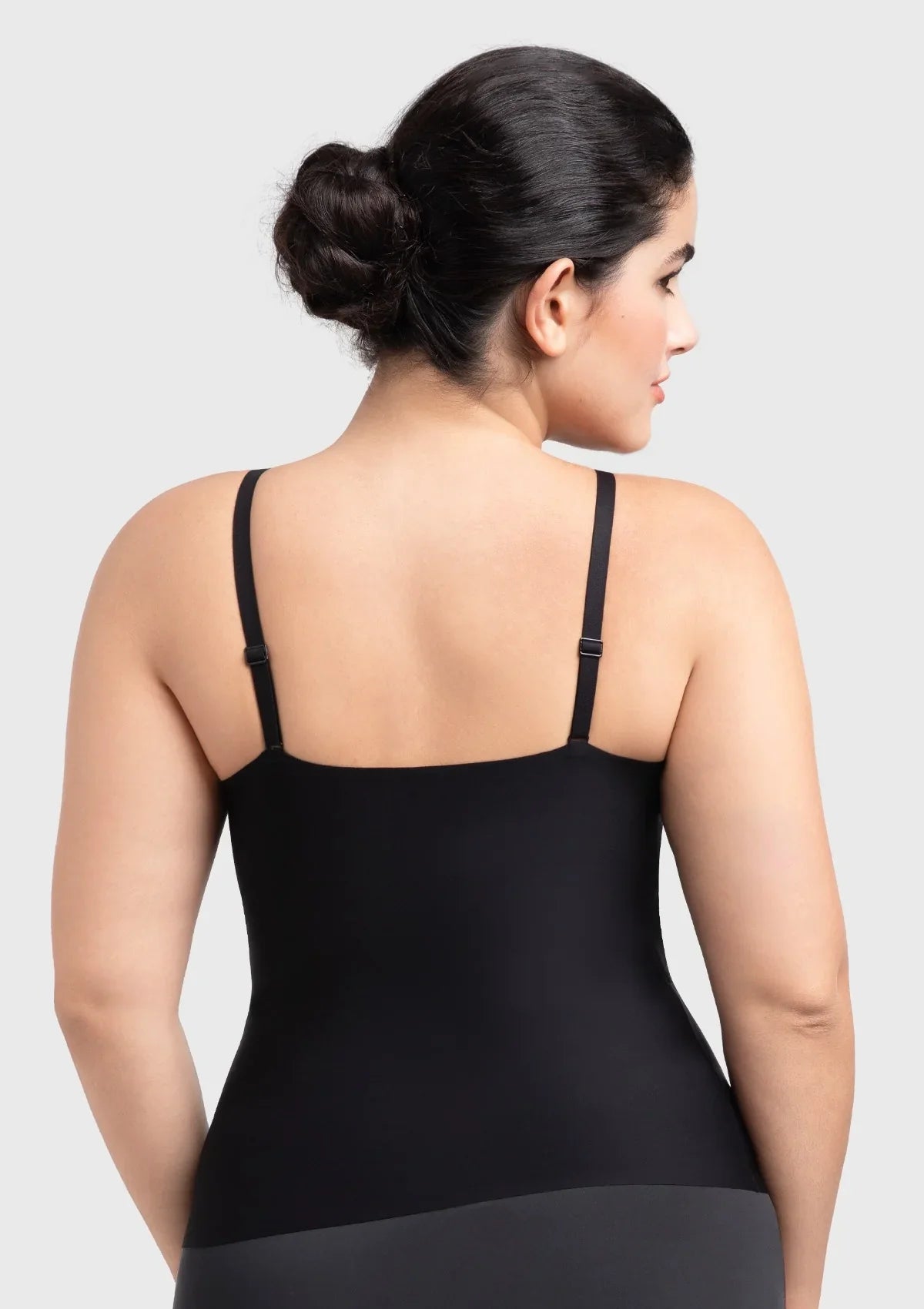 Back view of the black seamless tank top, featuring wide adjustable anti-slip straps for secure, all-day comfort without digging in.