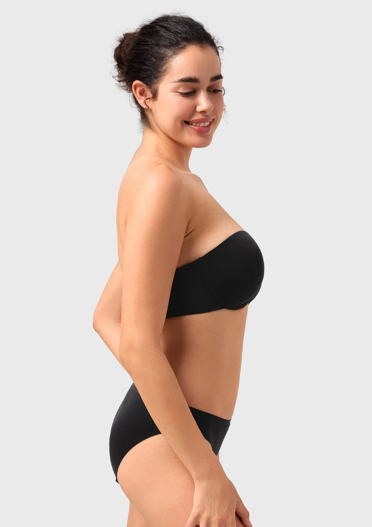 Side view of the black demi push-up bra, highlighting the flattering half-cup contour and smooth, seamless finish.