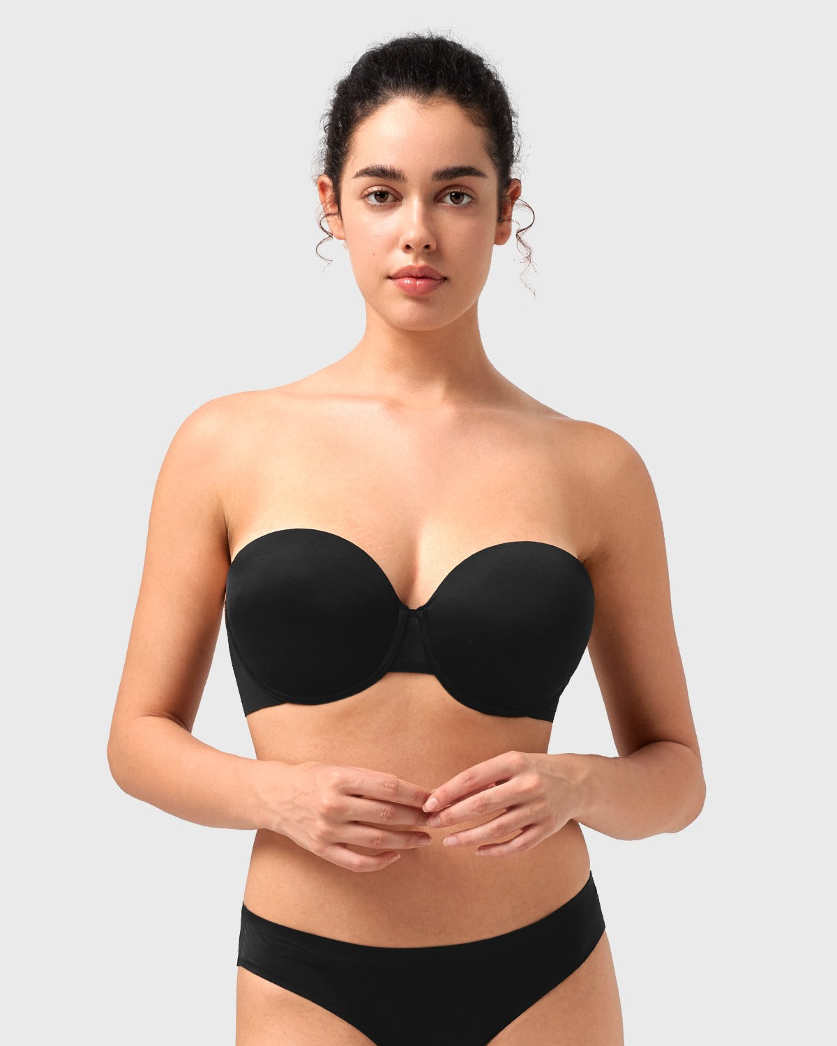 Front view of the black seamless push-up strapless bra, providing an elegant and invisible lift perfect for evening wear and party dresses.