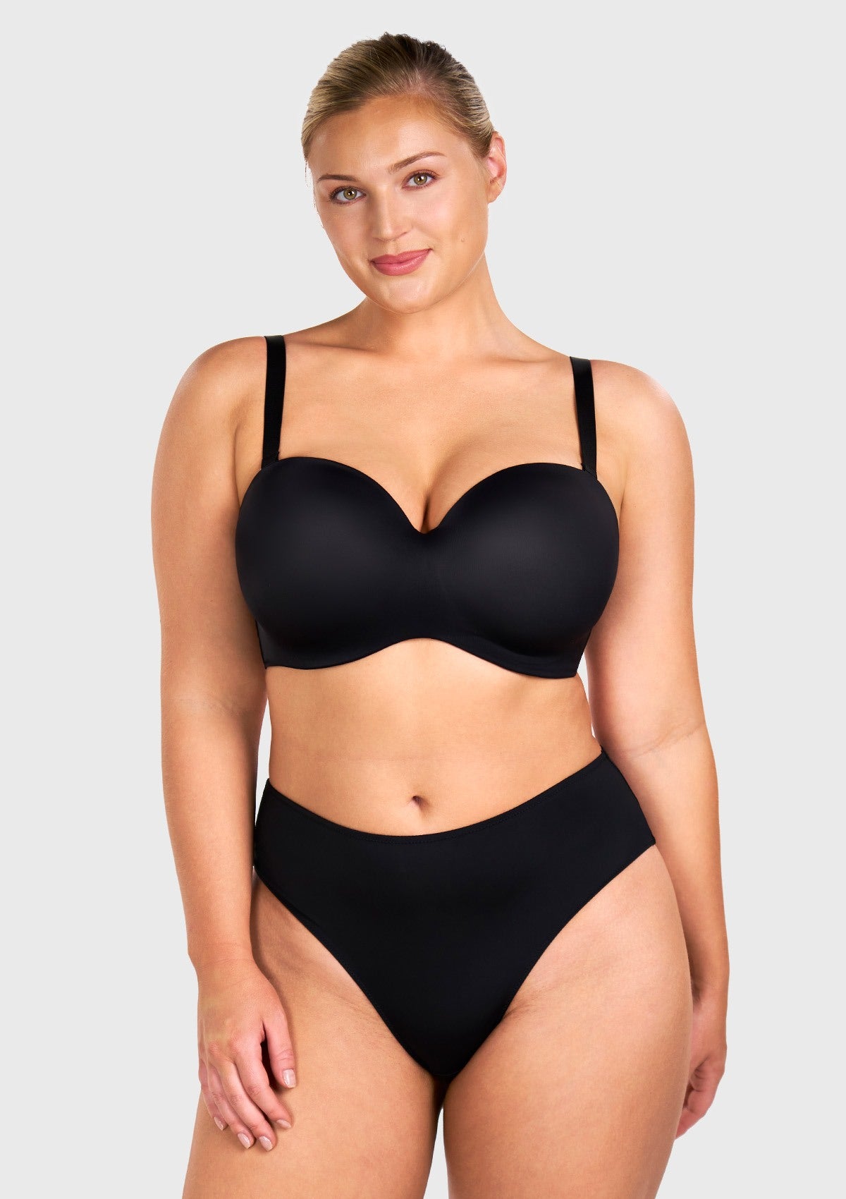 Front view of woman wearing the black HSIA seamless non-slip strapless bra