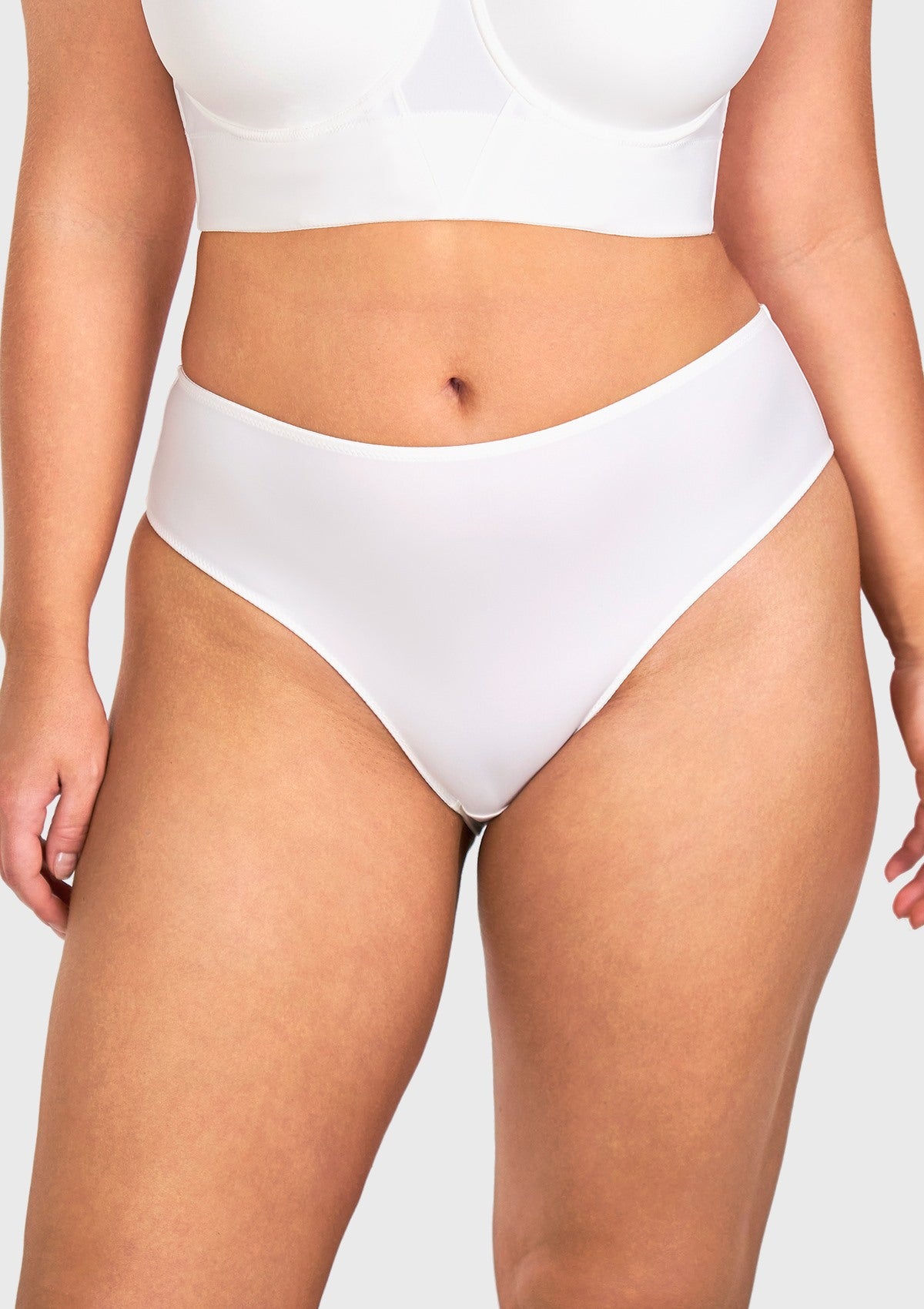 Front view of model wearing the HSIA white modern high brief panty, crafted from high-stretch microfiber for a breathable second-skin fit.