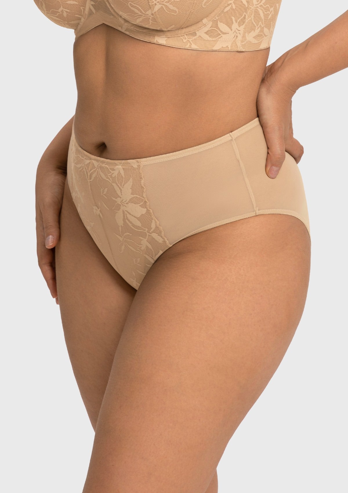 Side angle of model wearing the light beige Petalia high rise panty, highlighting the comfortable mesh side panels.