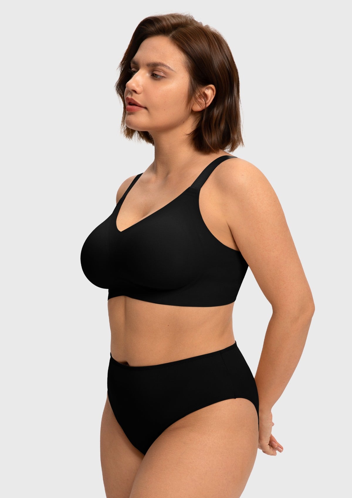 Side profile of model in the black SoftTouch jelly bra, showcasing the deep 3D molded cups and innovative W-shaped support for natural lift without underwires.