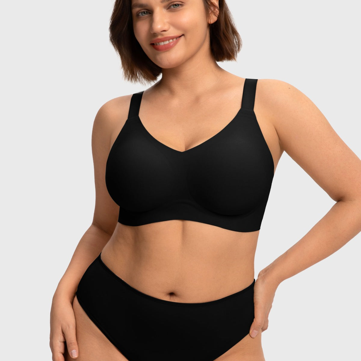 Front view of model wearing the HSIA black SoftTouch wireless jelly fit bra, featuring a sleek V-neckline and seamless everyday comfort for fuller figures.