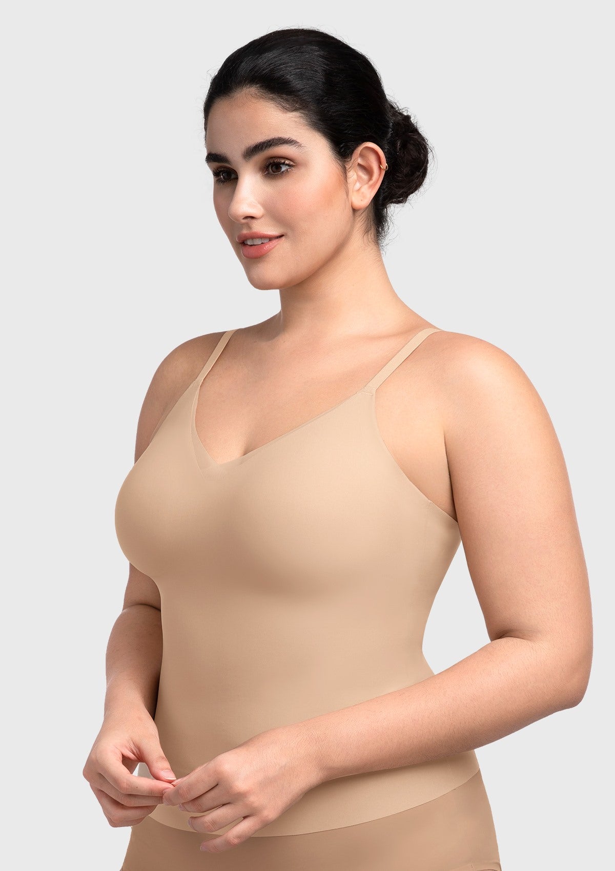 Side angle of the nude buttery-soft padded bra top, demonstrating the gentle torso elongation and flattering wire-free lift.