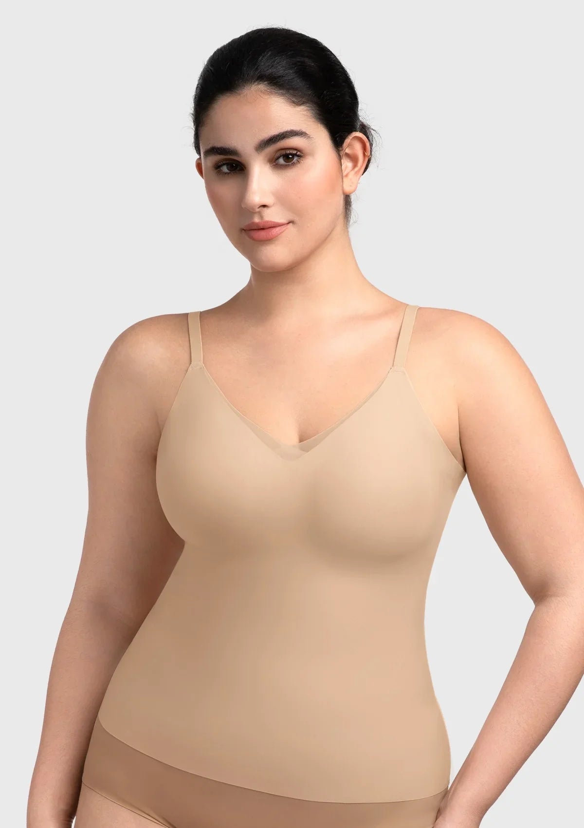 Front view of the nude seamless camisole with a built-in bra, offering a true naked sensation and perfect invisibility under sheer tops.