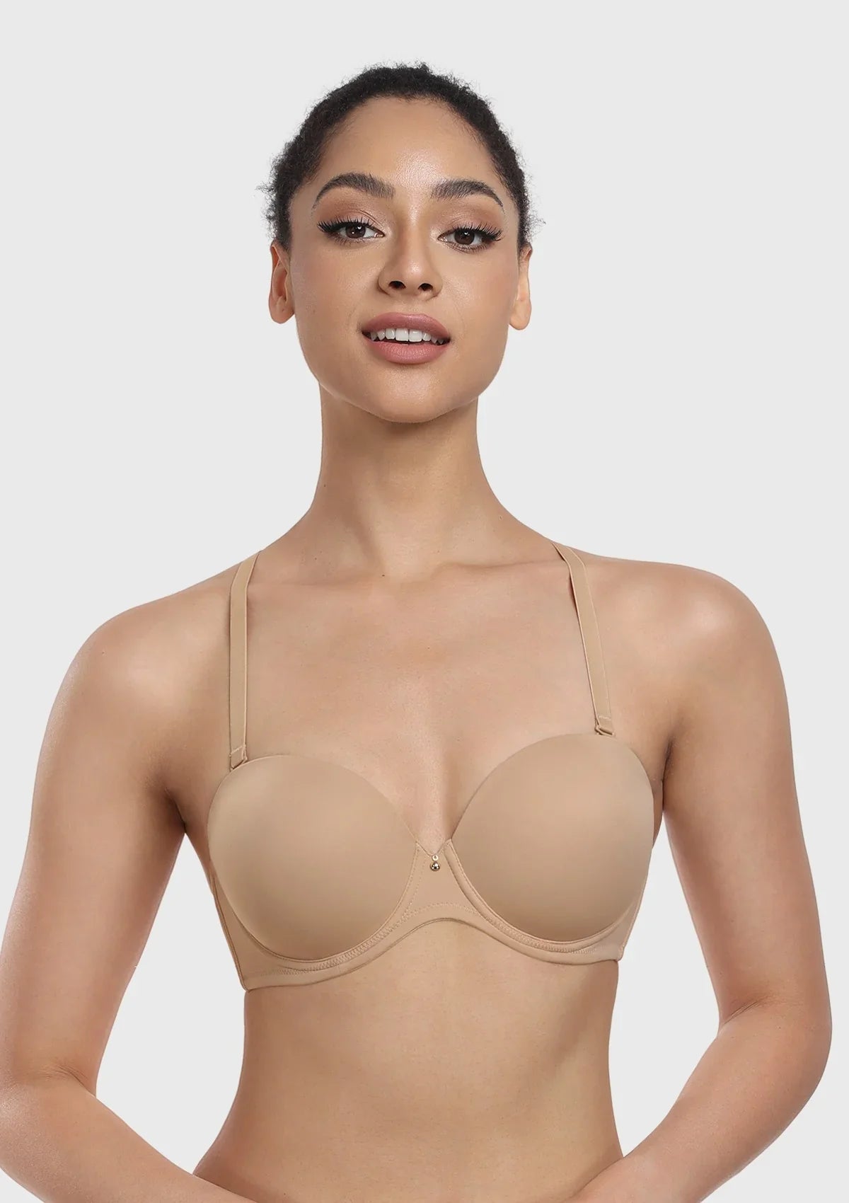 Woman wearing the nude underwire multiway bra with attached straps, demonstrating versatile and reliable everyday support.