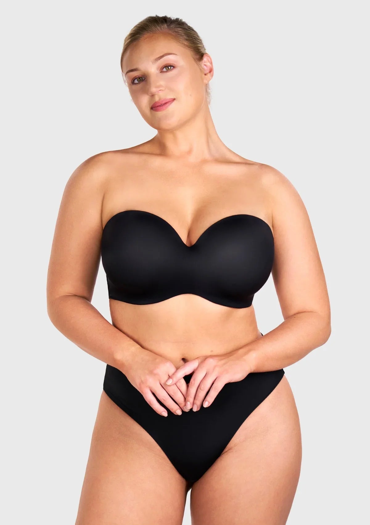 Front view of the black strapless bra worn with convertible straps for daily support