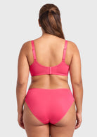 Rear view of the Knockout Pink Seraphina unlined bra on model, highlighting the customized closure system and engineered straps that adapt flawlessly to your bust size.